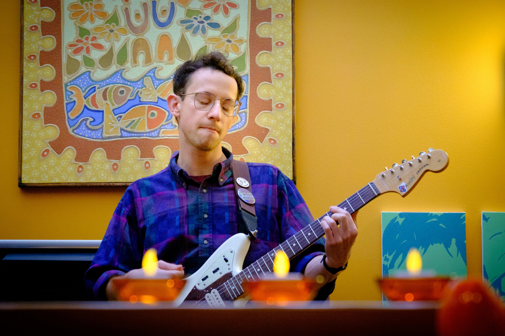 Low interior lighting makes for challenging exposures. Here, Keith Bower Brown of the band Trails and Ways performs at a private house party.  Camera: Fujifilm X-T1 Shutter speed: 1/125 second Aperture: f/5.0 ISO: 3200 Photo: Jeff Carlson
