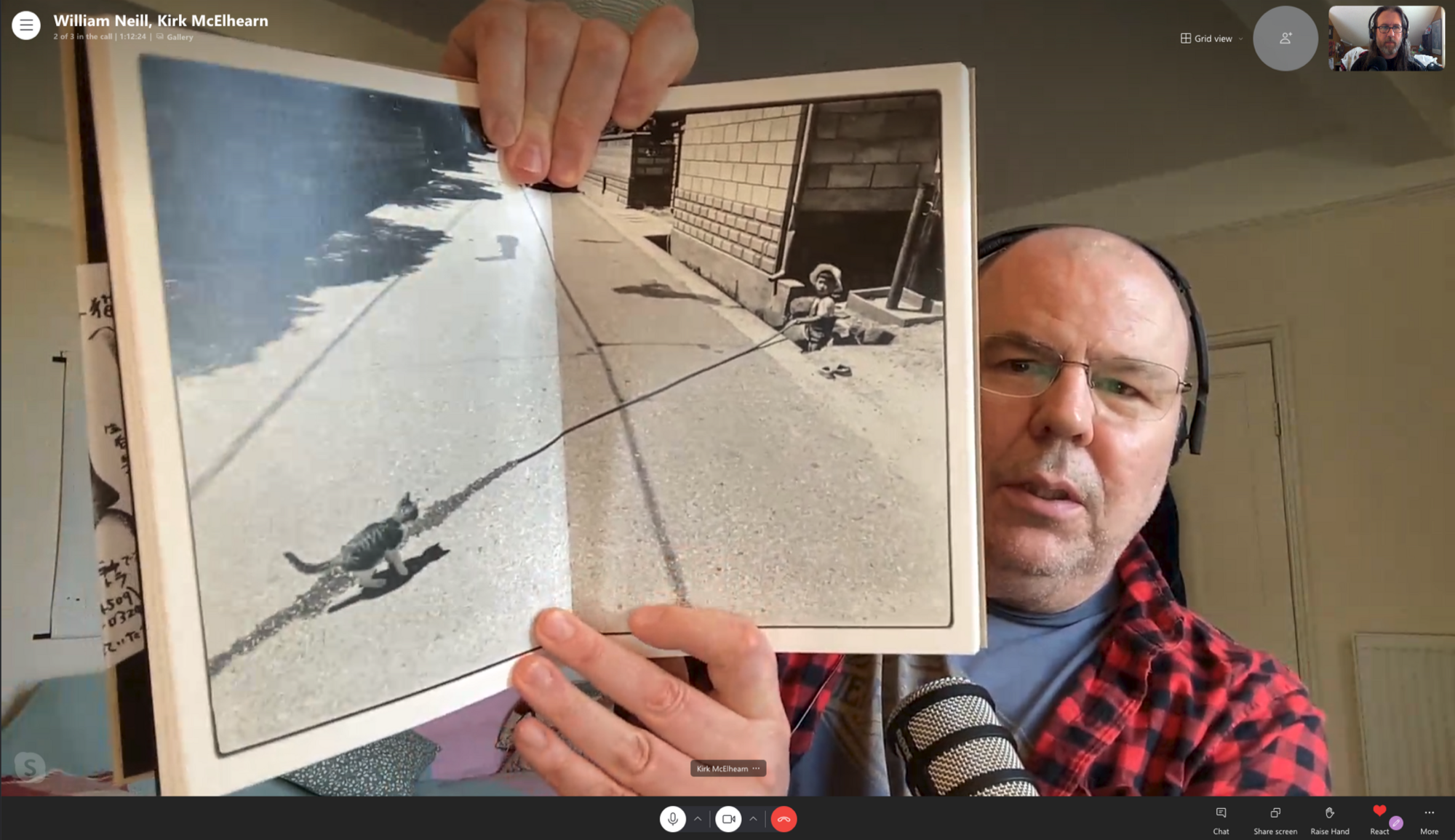 Kirk holds up a copy of Sasuke, by Masahisa Fukase