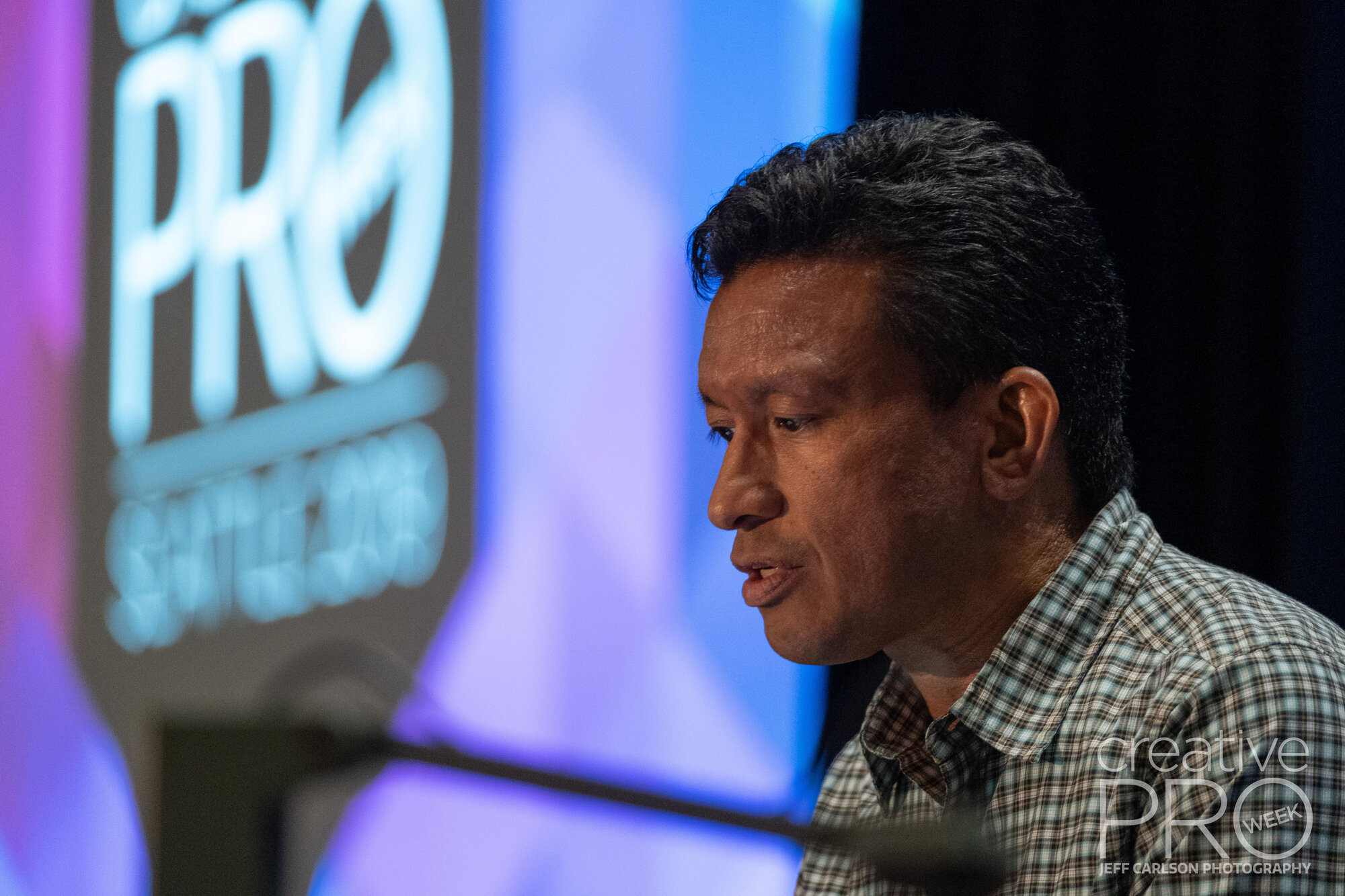 Speaker Conrad Chavez at CreativePro Week 2019 Camera: Fujifilm X-T3 Shutter speed: 1/125 sec Aperture: f/2.8 ISO: 3200 Lens: Fujifilm XF 50-140mm f/2.8 LM OIS WR Photo: Jeff Carlson, courtesy of CreativePro Week